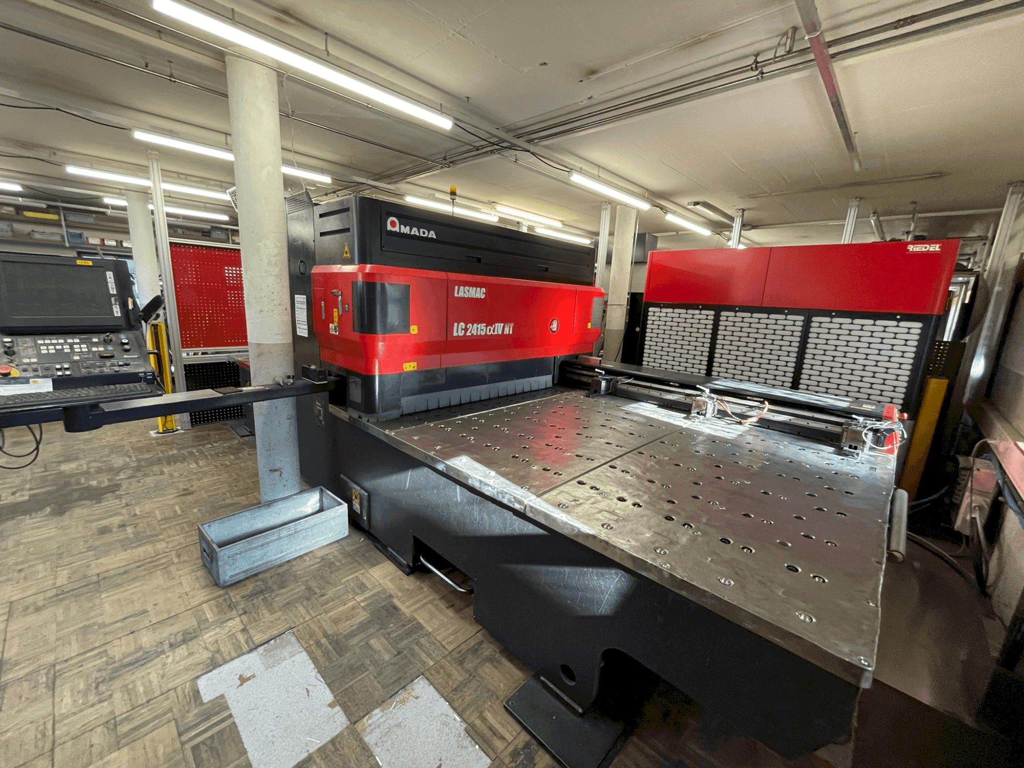 Front view of AMADA LC 2415 α-IV NT  machine