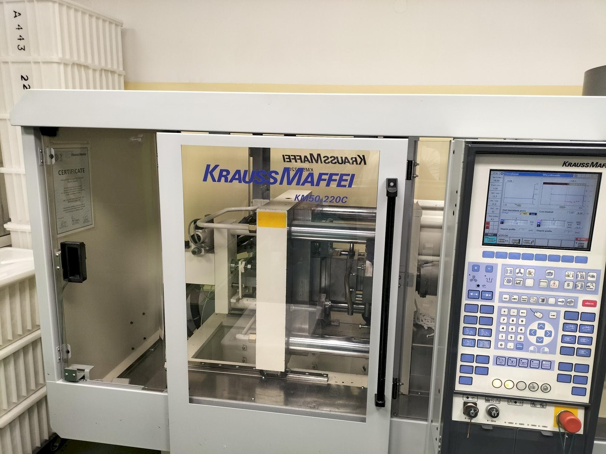 Front view of Krauss Maffei KM 50-220C Win  machine