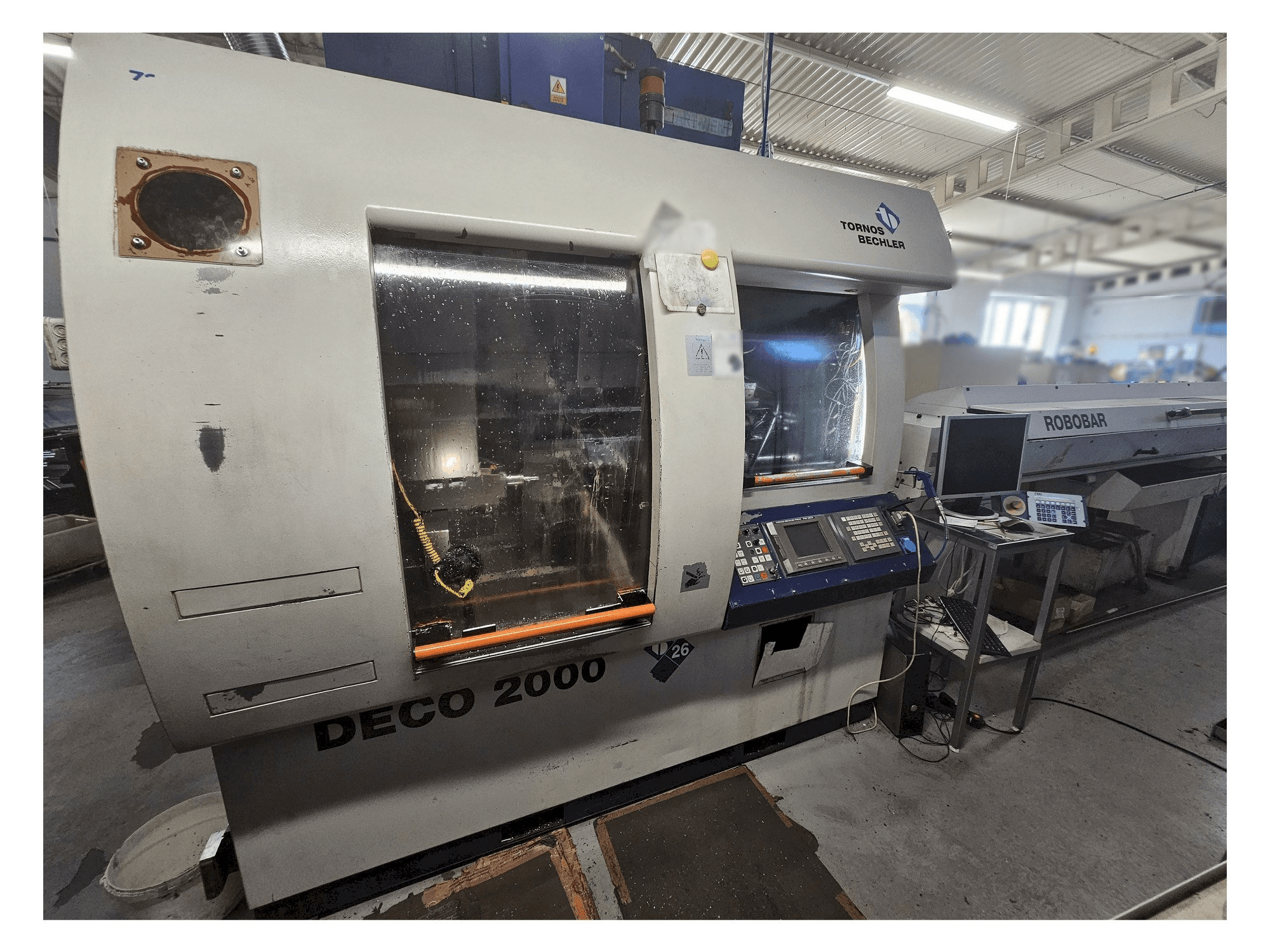Front view of Tornos Deco 26 machine