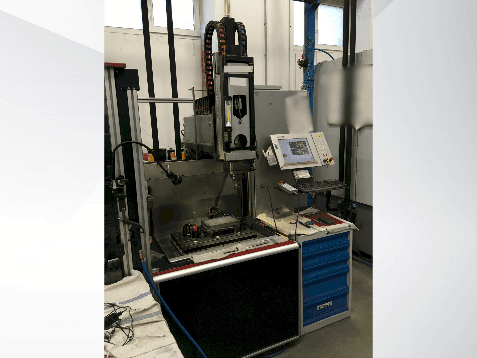 Front view of Exeron EDM 310 MF20 machine