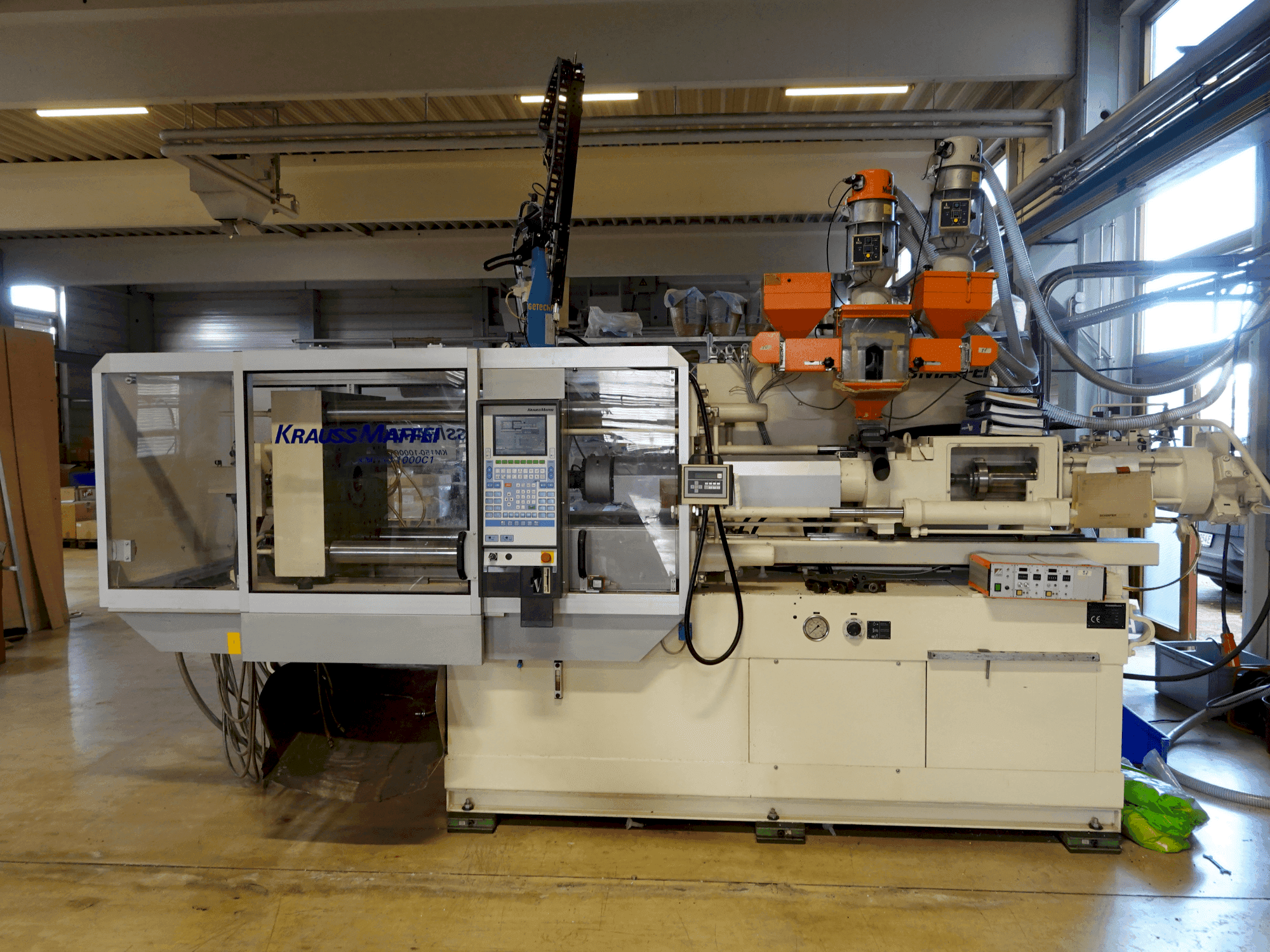 Front view of Krauss Maffei KM 150-1000 C1 machine