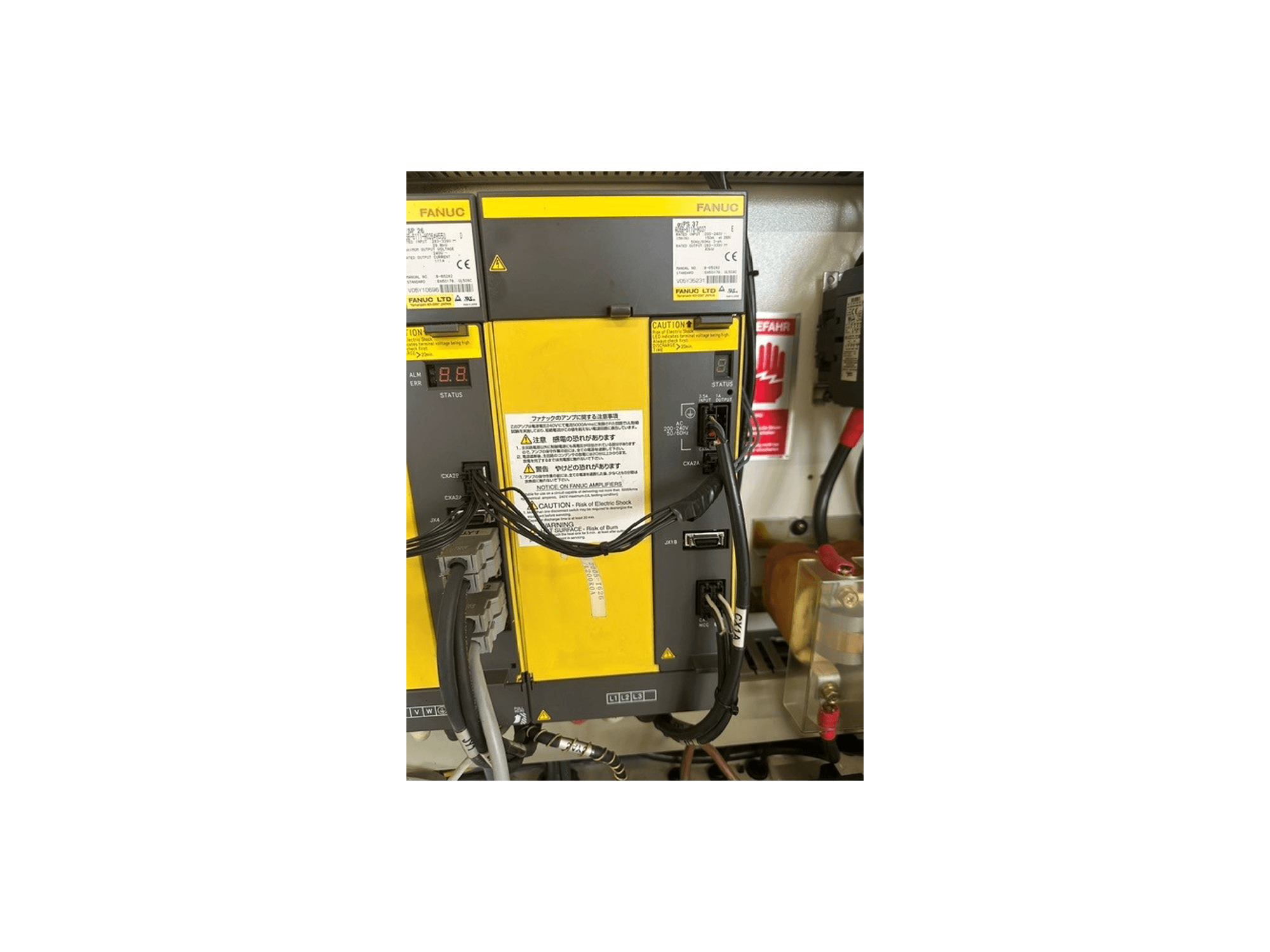 Control panel of MIKRON HSM 600 U Universal Machining Centre, showing FANUC components, status display, and wiring connections.